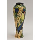 A contemporary Moorcroft Green Woodpecker design slender ovoid vase, tube lined with woodpeckers,