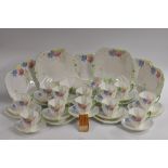 A Shelley Queen Anne shape Anemone pattern tea service, for twelve, decorated with red,