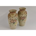A pair of Langley Mill ovoid vases, incised with poppies and foliage, in colours on a buff ground,