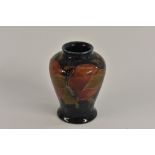 A miniature Moorcroft Pomegranate pattern inverted baluster vase,