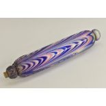 A Nailsea glass rolling pin, combed in pink, blue and white, 33cm long, c.