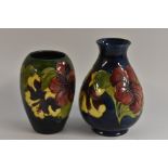 A Moorcroft Hibiscus pattern ovoid vase, tube lined with large flowers and foliage, in tones of red,