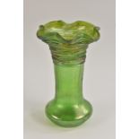 A Loetz style iridescent green glass vase, wavy flared everted rim, trailed spidery banding,