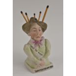 A rare German bisque match holder, as a Suffragette, inscribed Votes for Women .....