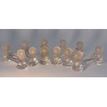 A set of six Crystal de Houden Baby Face knife rests, 9cm wide,