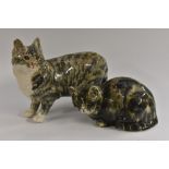 A Winstanley model, of a cat, grey tabby markings, standign on all four, glass eyes, 39cm cm long,