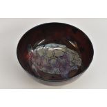 A Bernard Moore flambé lustre glazed bowl the centre applied with a tortoise in silver lustre,