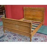 A king size hardwood sleigh bed