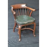 An early 20th century mahogany Captains chair,