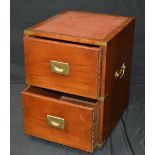 A reproduction campaign style two drawer cabinet