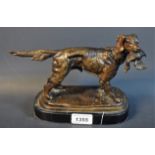 English School, a dark patinated bronze, gun dog retrieving a bird, oval marble base, 25cm wide,