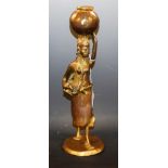 Benin School, a gilt bronze, of a tribeswoman carrying an infant and a water vessel,