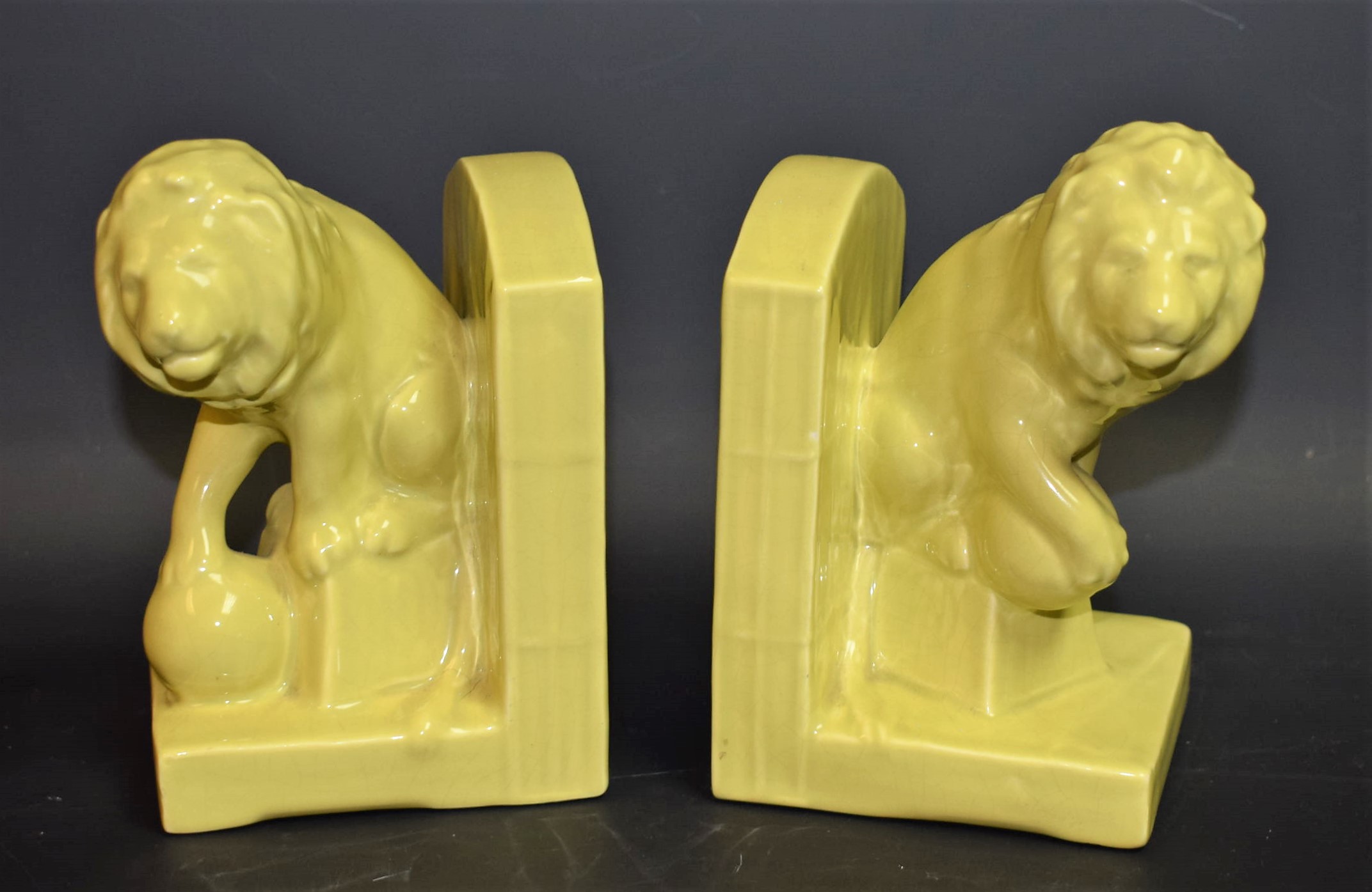 A pair of Bretby green glaze bookends,