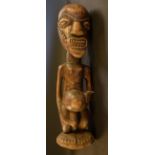 Tribal Art - an African fertility figure, 58cm high,