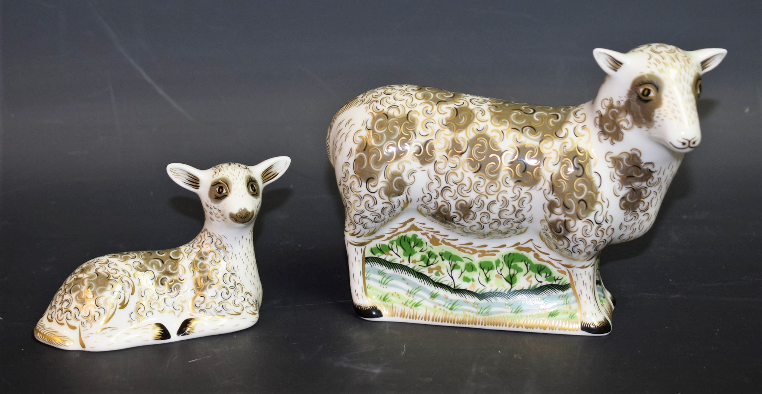 A Royal Crown Derby paperweight, Jacob Sheep, gold stopper, boxed; another, smaller, Jacob Lamb,