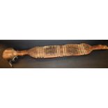 Tribal Art - a Tuareg tent peg, the broad central section shaped and carved in horizontal bands,