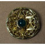 A 9ct gold circular brooch, green stone set, total weight approx.