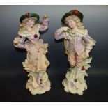 A large pair of Victorian bisque figures, of a Gallant and his companion, wearing court dress, c.