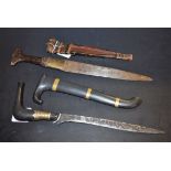 A Tuareg/Sudanese dagger, 23cm pointed tapered blade, hide bound handle and scabbard,