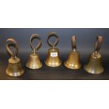 A set of four brass campanology bells, leather strap handles, the smallest marked 12oz, 8cm to 6.
