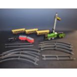 Mettoy - an O gauge clockwork tin plate passenger train set comprising 0-4-0 locomotive and