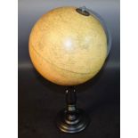 A 10" terrestrial globe, the Phillip's Challenge Globe, turned ebonised base,