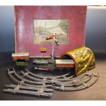 A Fischer German clockwork pressed tin plate train set, 0-4-0 locomotive and tender, green livery,