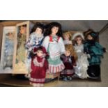 A quantity of dolls, many with porcelain heads, period clothing,