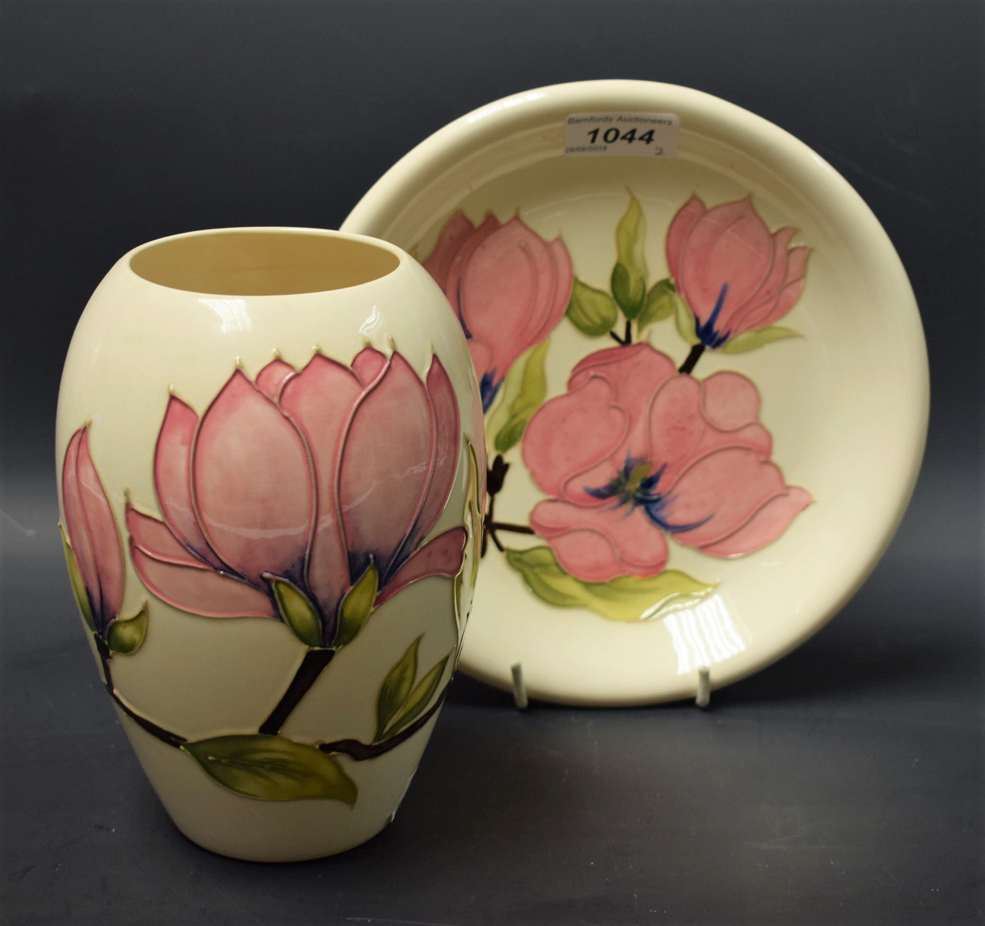 A Moorcroft Magnolia pattern dish, 21.