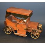 An Italian retro teak model, of a vintage car, brass mounted, stamped Teak Birmany Creazioni C.A.M.