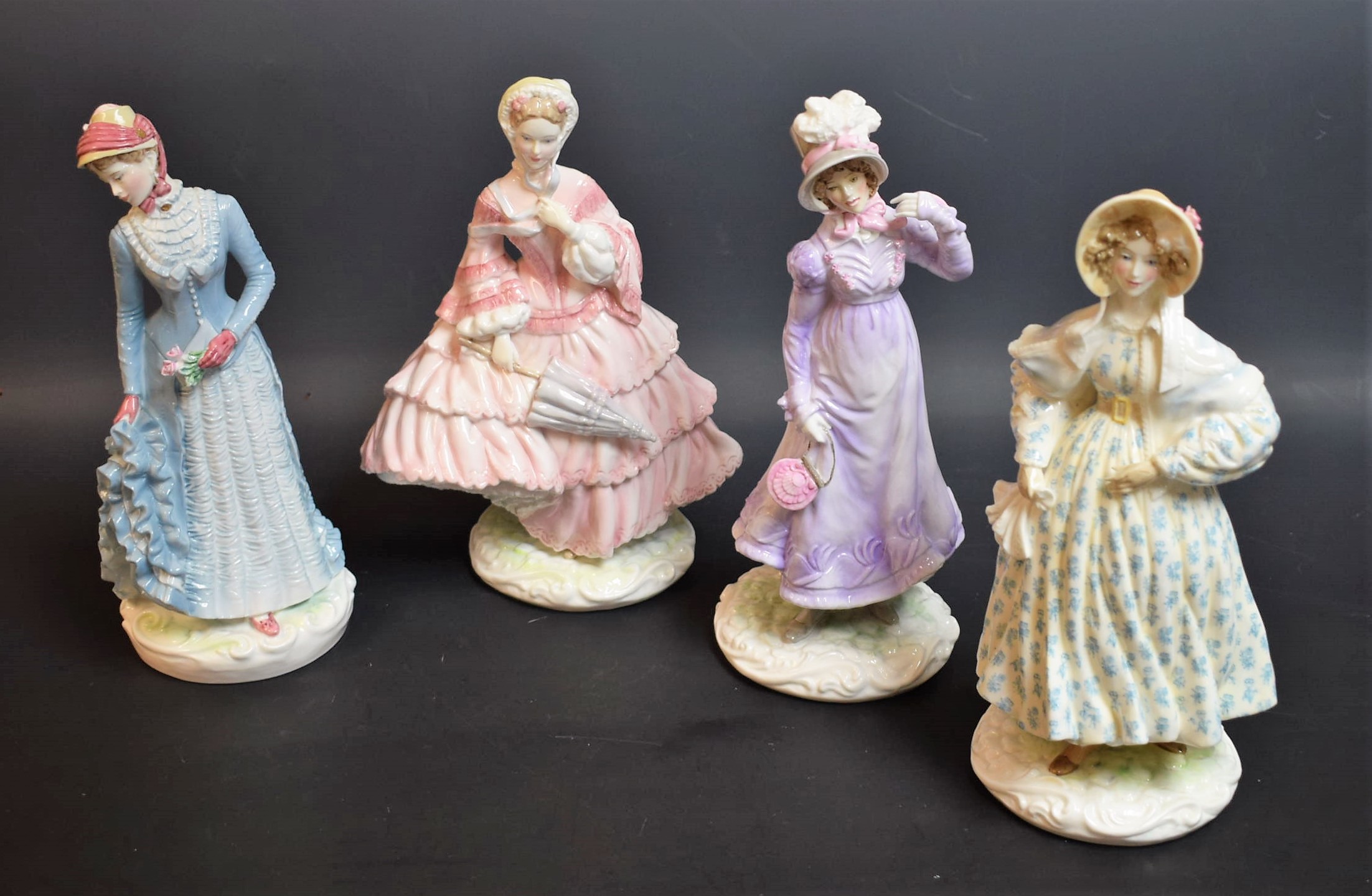 A set of four Royal Worcester figures, The Victoria and Albert Museum costume collection,