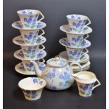 A Colclough part tea service, decorated with flowers, comprising cups, saucers, plates, milk jug,