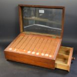 A late Victorian mahogany slope-top rectangular haberdashery shop counter needle display case,