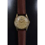 Longines - a vintage 1950s gentleman's 9ct gold cased wrist watch, textured dial,