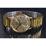 Garrard - a vintage 1970s automatic 9ct gold cased wrist watch, brushed silvered dial,