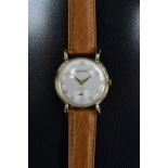 Garrard - a vintage 1960s gentleman's wristwatch, textured silver dial, Arabic numerals,