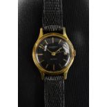 Ingersoll - a vintage Trendsetter gold plated wristwatch, black dial, gilt block batons,