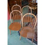 A set of four Ercol blonde dining chairs