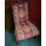 A Victorian oak nursing chair, c.