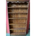 A pine six shelf bookcase