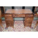 A reproduction mahogany twin-pedestal desk,