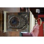 A heavy brass 'bracket' mantel clock,