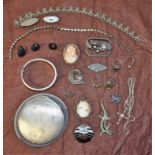 A silver powder compact; a silver bangle; a late 19th century agate brooch; black cat charms;