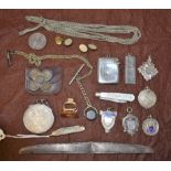 A silver vesta case; a Toledo fob knife; shield and other fobs; a Thaler coin,
