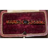 A Victorian garnet set brooch, stamped 375,