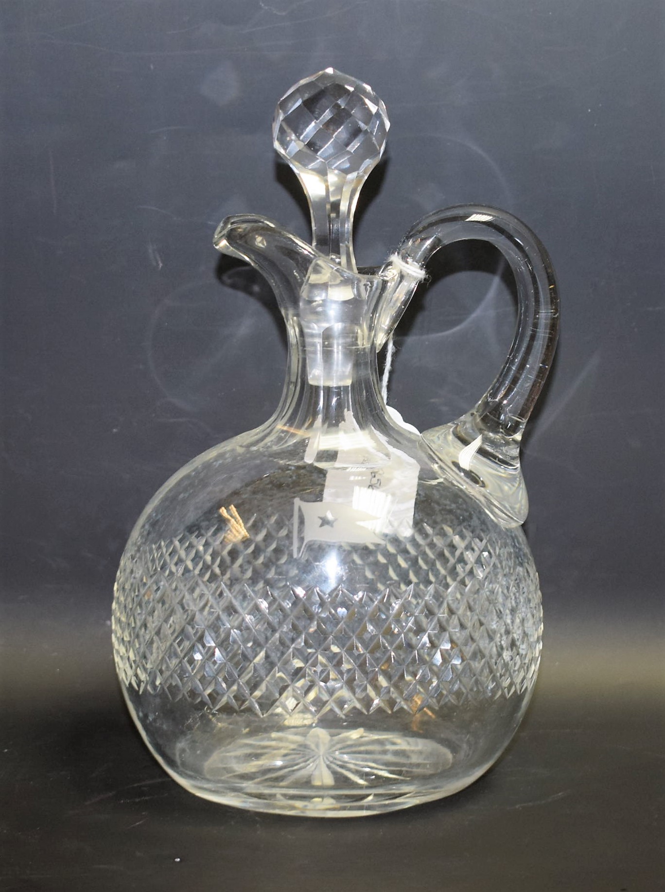 A cut glass flattened ovoid claret jug, etched with the flag of the White Star Line,