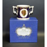 A Royal Crown Derby Goviers of Sidmouth limited edition twin handled loving cup, 151/650,