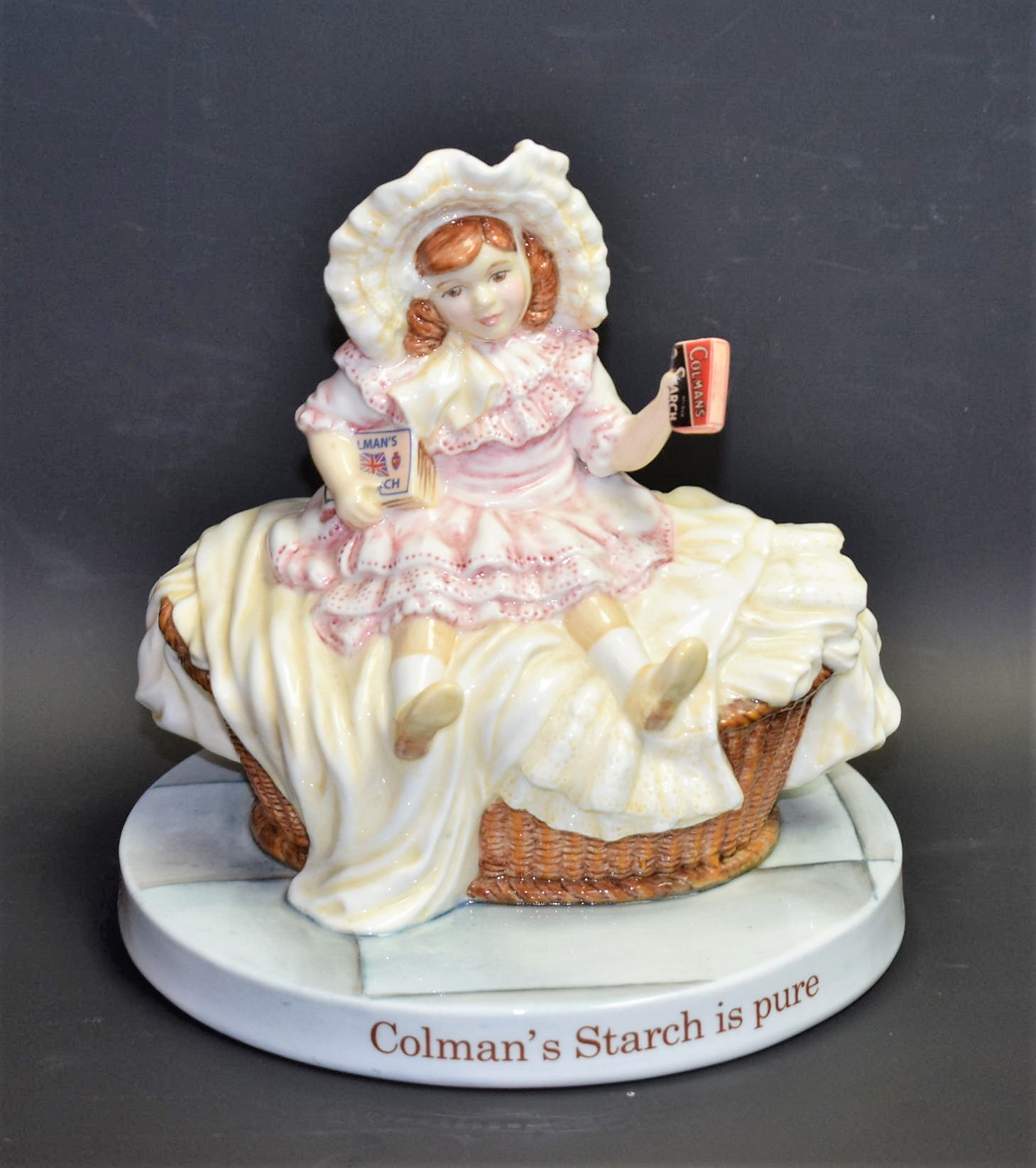 A Royal Doulton ceramic advertising figure, Colman's Starch Girl, MCL31,