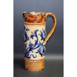 A Doulton Lambeth cylindrical jug, designed by Mark V Marshall, incised with stylised thistles,