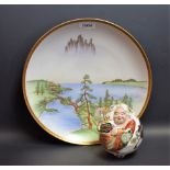 A Japanese Satsuma porcelaneous novelty, of a comic figure, painted in colourful polychrome,